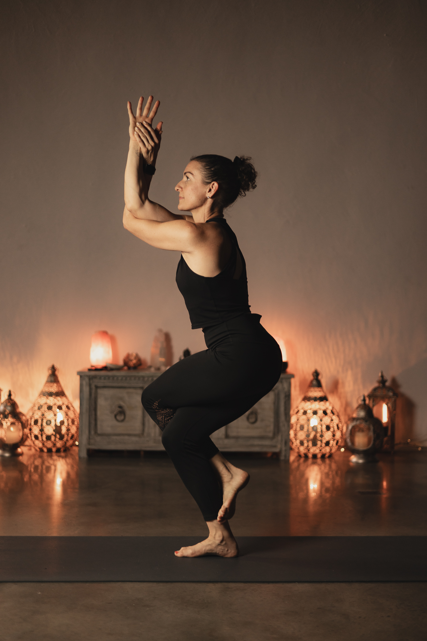 Trainer Tash Katsimbardis demonstrating Eagle Pose during a yoga teacher training in Perth, showcasing balance, focus, and mindful alignment.
